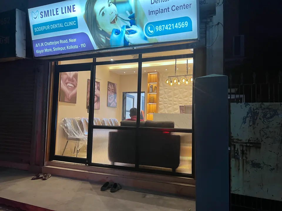 Smile Line — Sodepur Dental Clinic storefront, lit at night