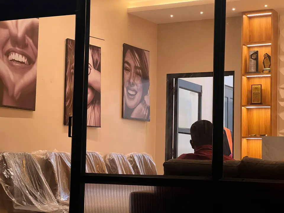 The signature smile-portrait wall greeting patients at Smile Line